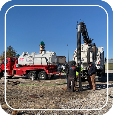 Reddi Services crew operating vacuum trucks during a sewer service